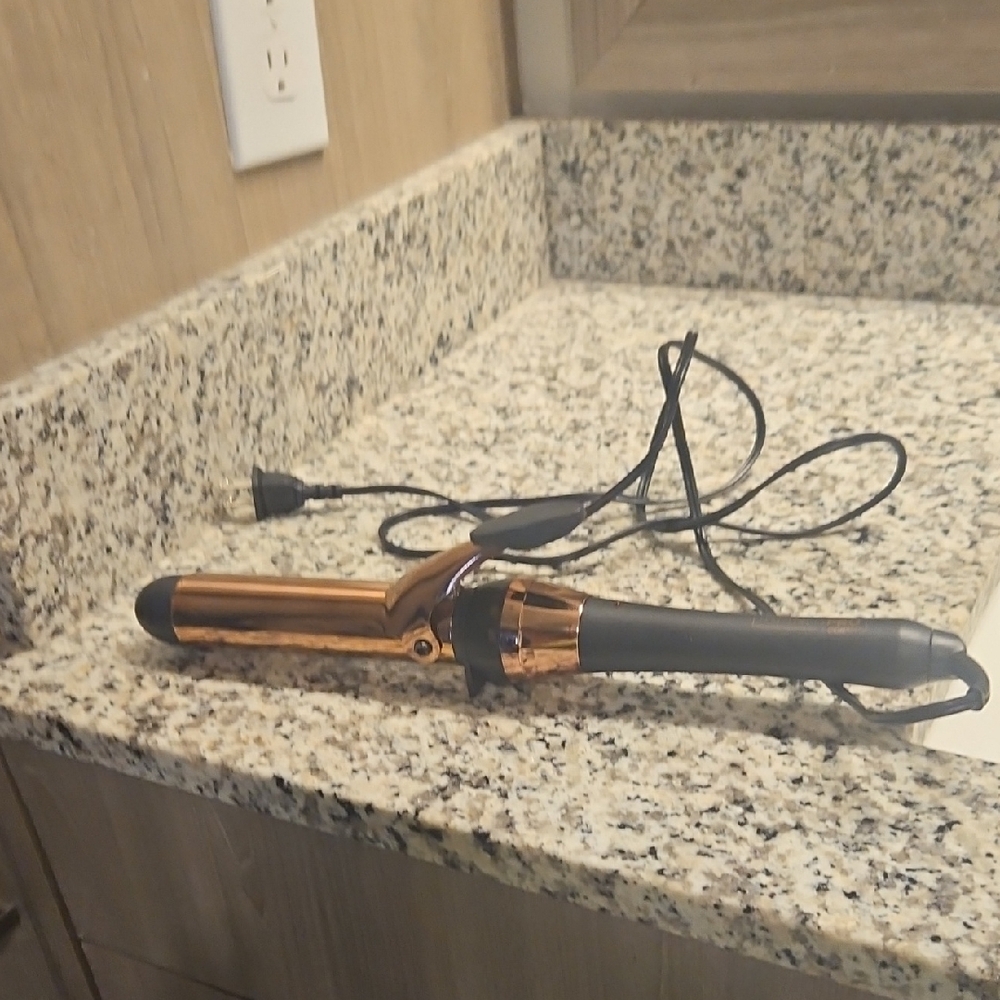 Sleek Black and Gold Curling Iron